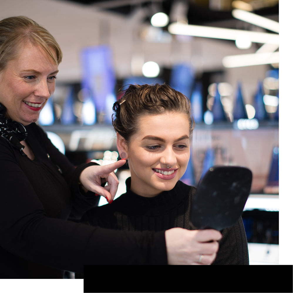 Beauty advisor with customer