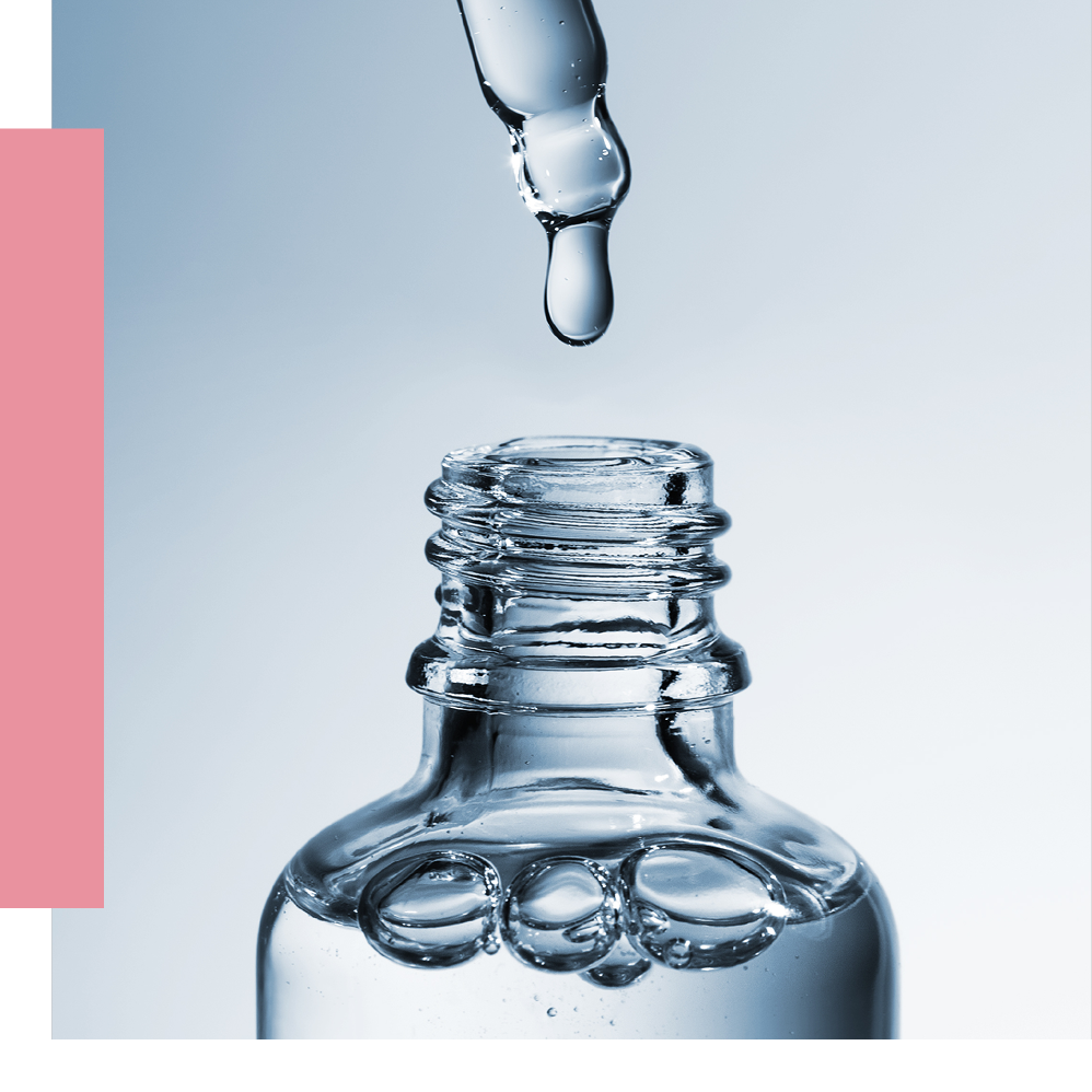 Drop falling into a clear bottle
