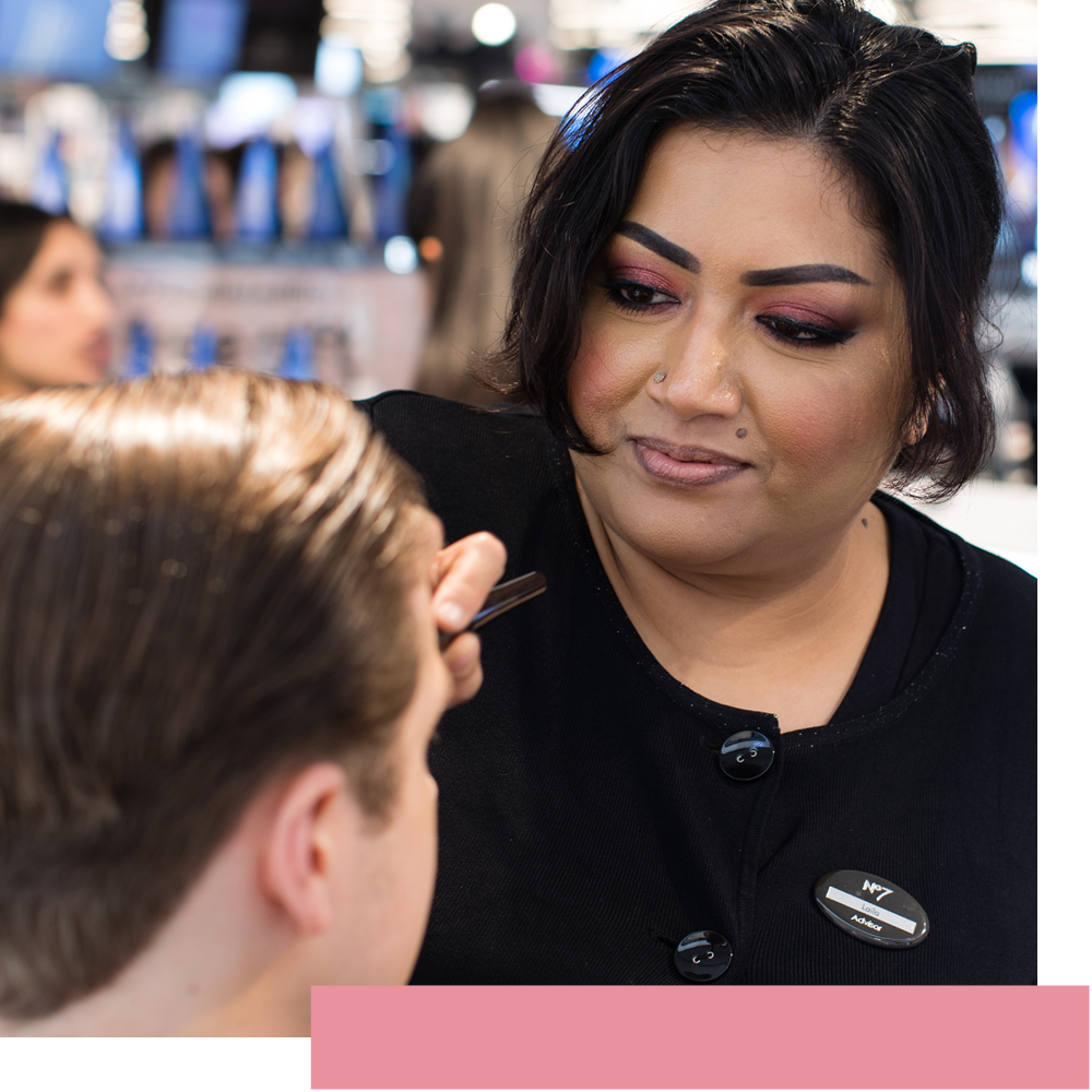 Female Boots Beauty Advisor applying make up on customer